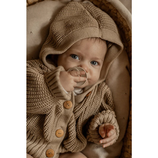 Baby in chunky, beige hoodie sweater from Chunky Knit Cardigan Sand collection