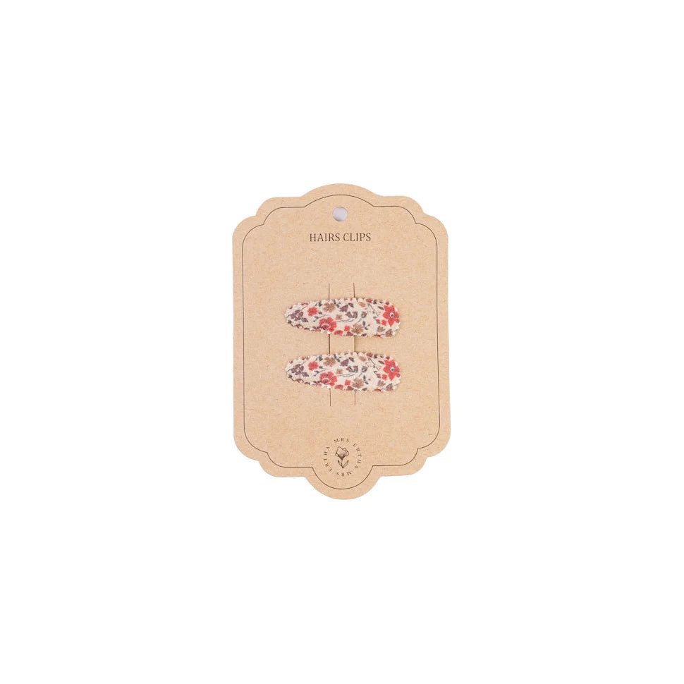 Florale Haarspangen auf einer Displaykarte für Magic Garden