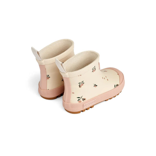 Creamfarbene Regenstiefel mit pinken Sohlen und kleinen Blumenmustern von Peach Sea Shell
