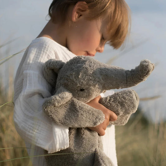 Cuddly Toy Elephant Small being lovingly hugged by a child