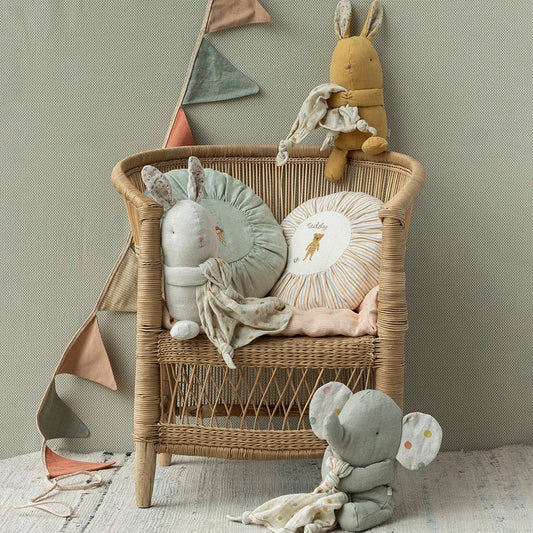 Changing chair decorated with plush animal cushions and toys from Lullaby Friends, Rabbit