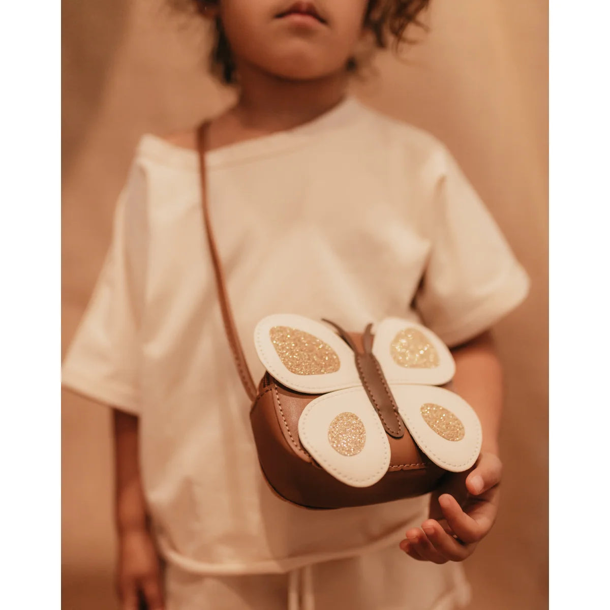 Schmetterlingsförmige Tasche mit eiförmigen Mustern auf den Flügeln der Mini Tasche