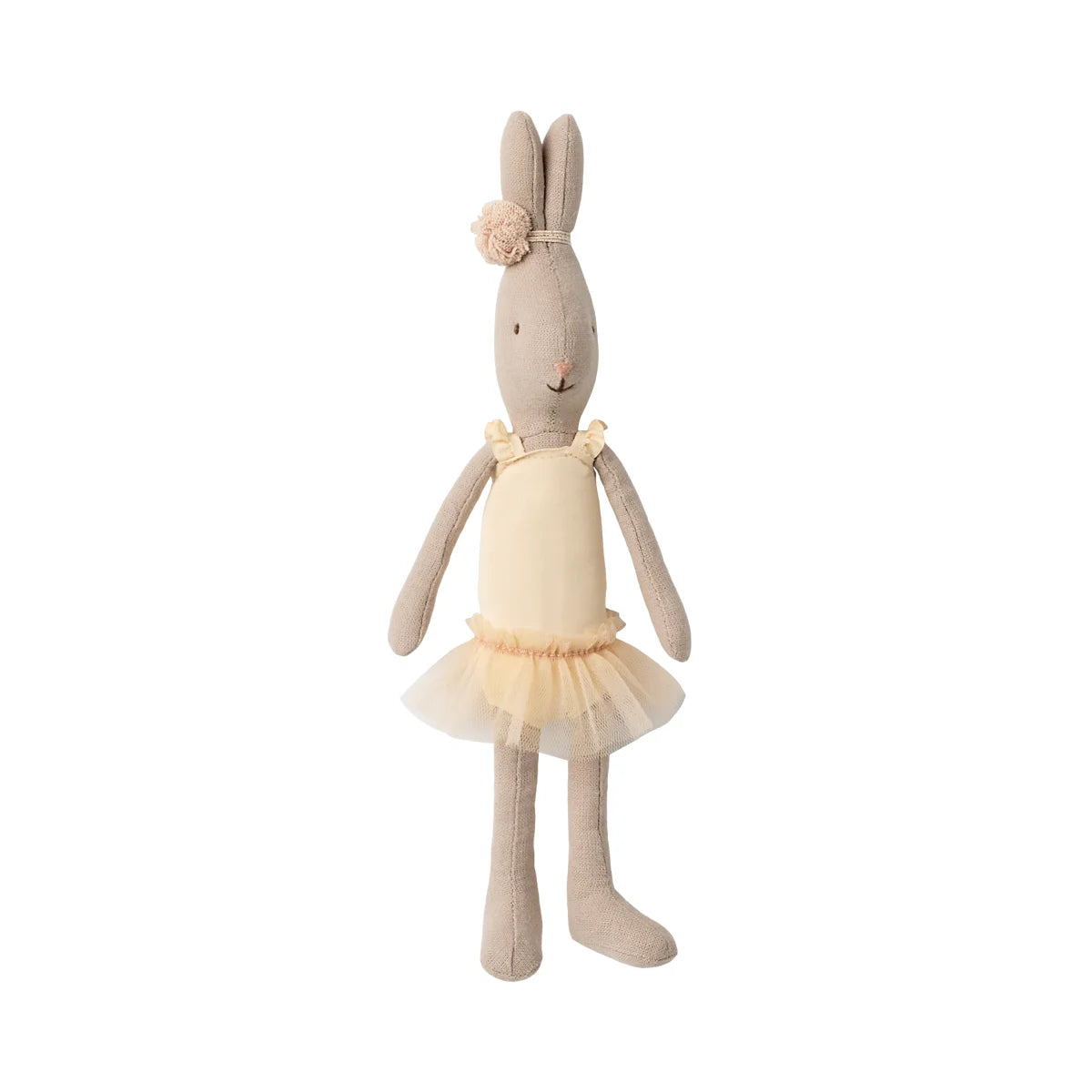 Eine weiche, beigefarbene Plüschkaninchenpuppe, gekleidet in ein zartes, cremefarbenes Ballett-Outfit mit einem gerafften Tütü und einer Spitzenblume auf dem Kopf.