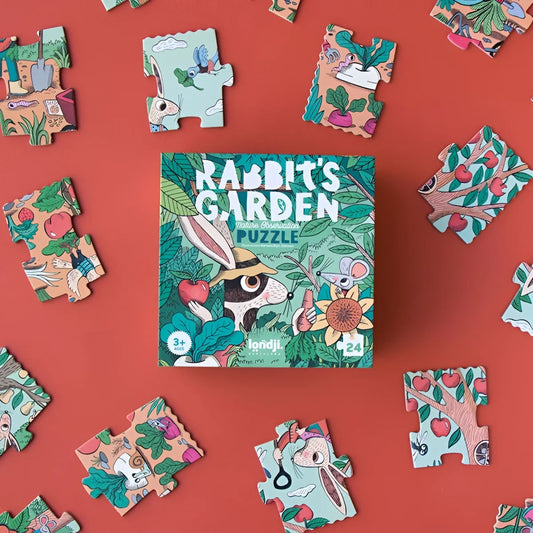 Puzzlebox von Rabbit’s Garden umgeben von bunten Puzzlestücken