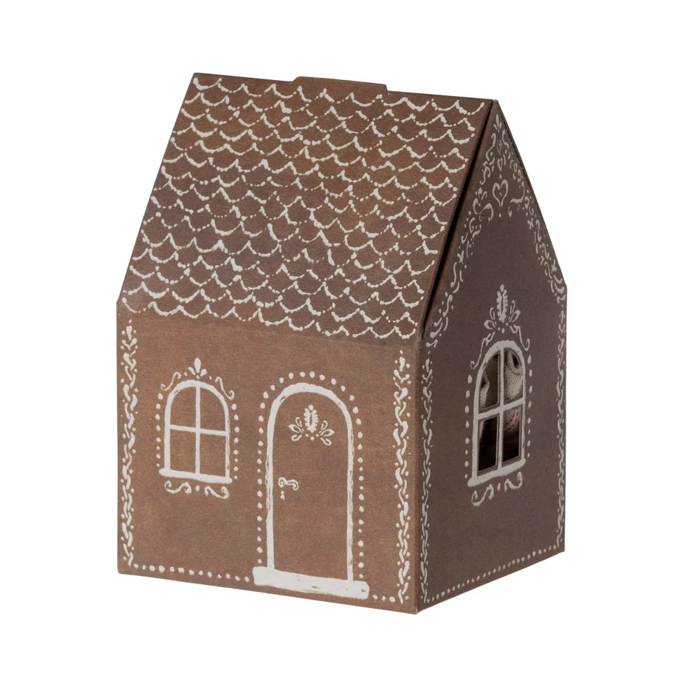 Gingerbread house cardboard box with decorative icing patterns for Santa Maus