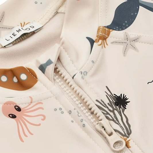 Gedrucktes Kinder-Schwimmjäupis mit Reißverschluss aus dem Produkt Schwimm-Jumpsuit Max Sea Creature Sandy