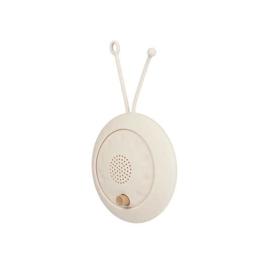 Helles cremfarbenes runder Baby-Mobile-Musikbox mit zwei oberen Schlaufen und Lautsprechergitter