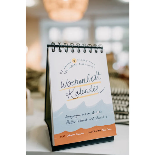 Bunter Wochenbettkalender mit Drahtbindung und buntem Cover, perfekt für Babyzeit