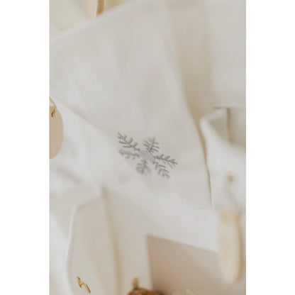 Weiße Leinenserviette mit silberner Schneeflocken-Stickerei für Adventskalender