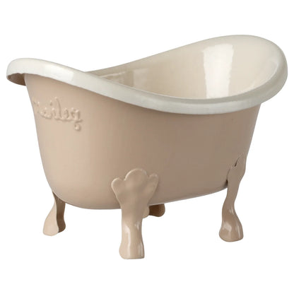 Beige keramische clawfoot badewanne badewanne maus rosa mit weißem innenraum und geprägt maisy branding ideal für ökologische baby- & kinderprodukte