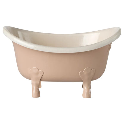 Vintage badewanne maus rosa mit weichem blush außen und weißen innenleben auf verzierten knochenförmigen füßen ideal für ökologische baby- & kinderprodukte