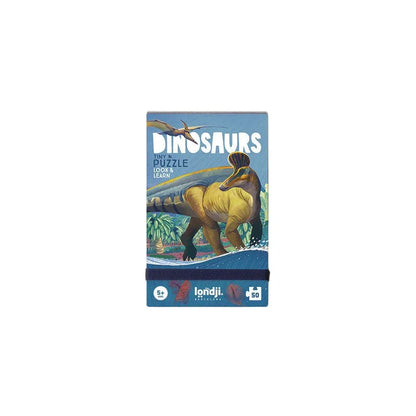 Blaues Rechteck für Londji Dinosaurs Tiny Puzzle mit gelbbraunem Dinosaurier und fliegendem Wesen am blauen Himmel