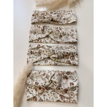 Vier beige Blumen-Haarbande mit weichem Knotendesign