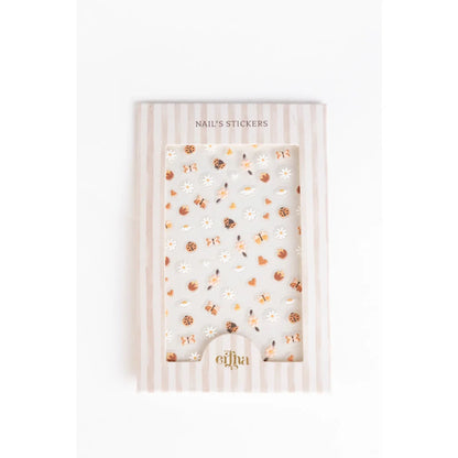 Elfa 3D-Nageltattoos für Kinder mit Blumenmotiv und Goldakzenten auf weißem Hintergrund