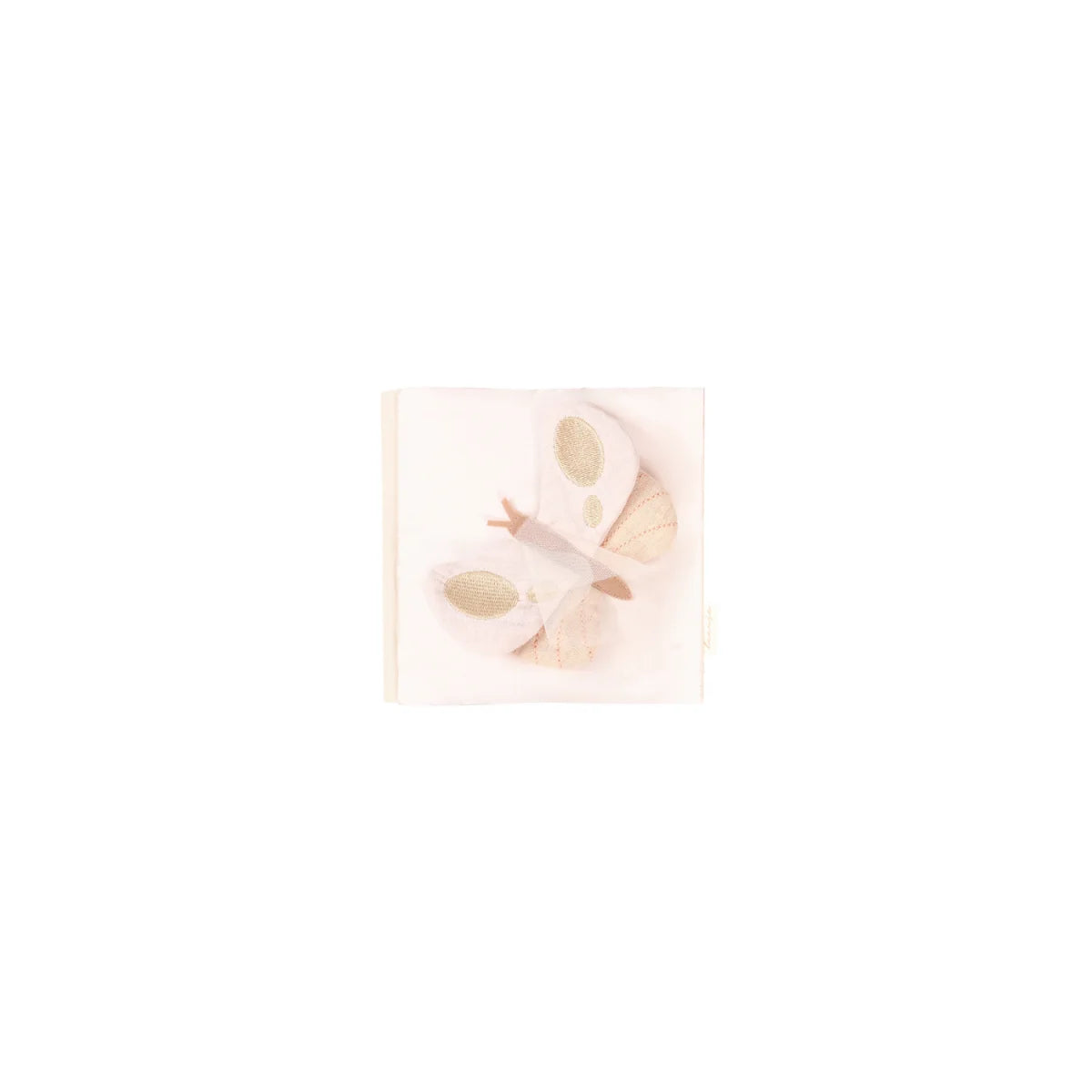 Knisterbuch butterfly mit einer cremefarbenen papierserviette und besticktem schmetterling ideal für ökologische baby- & kinderprodukte