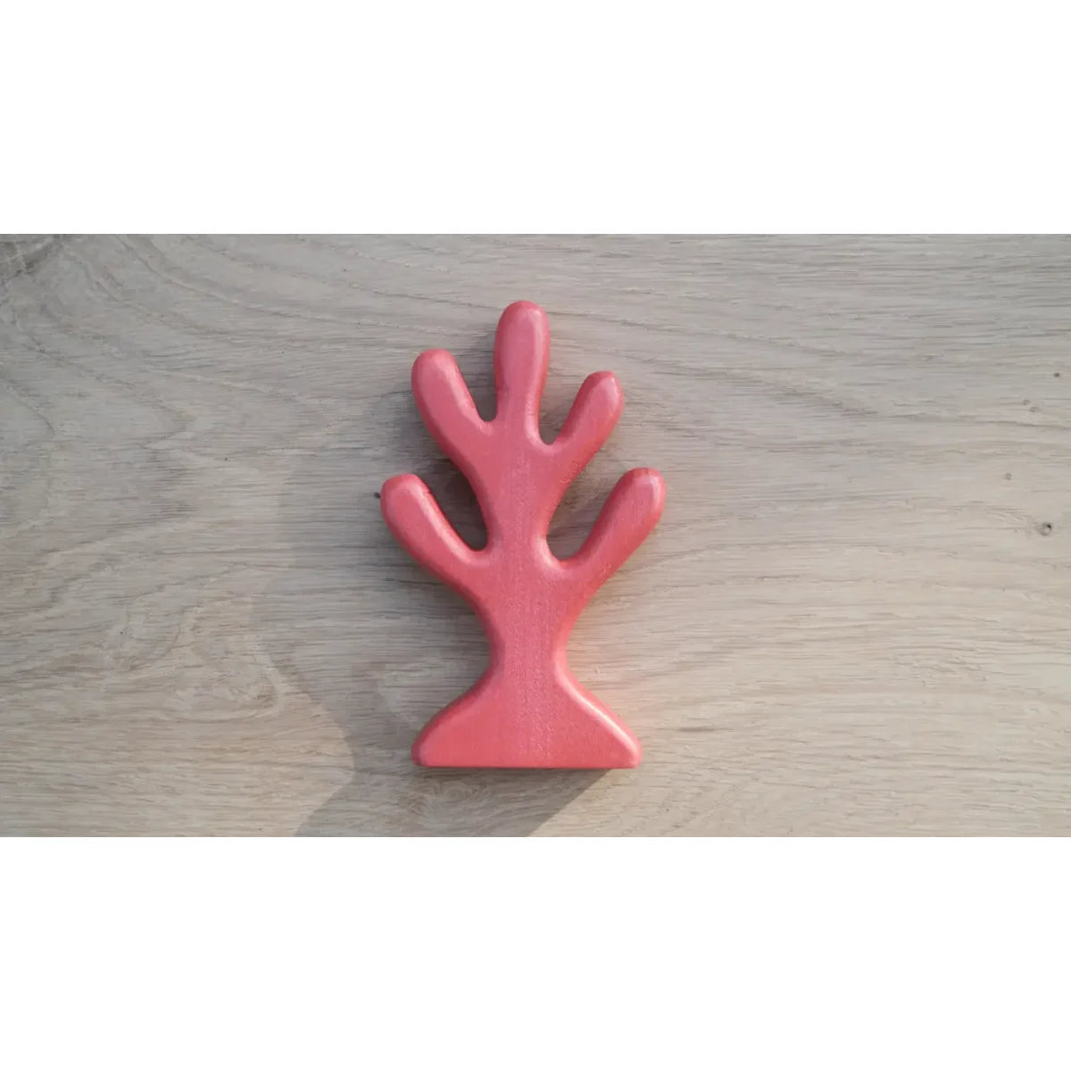 Koralle Rot: Rosa korallenförmiges Holzspielzeug