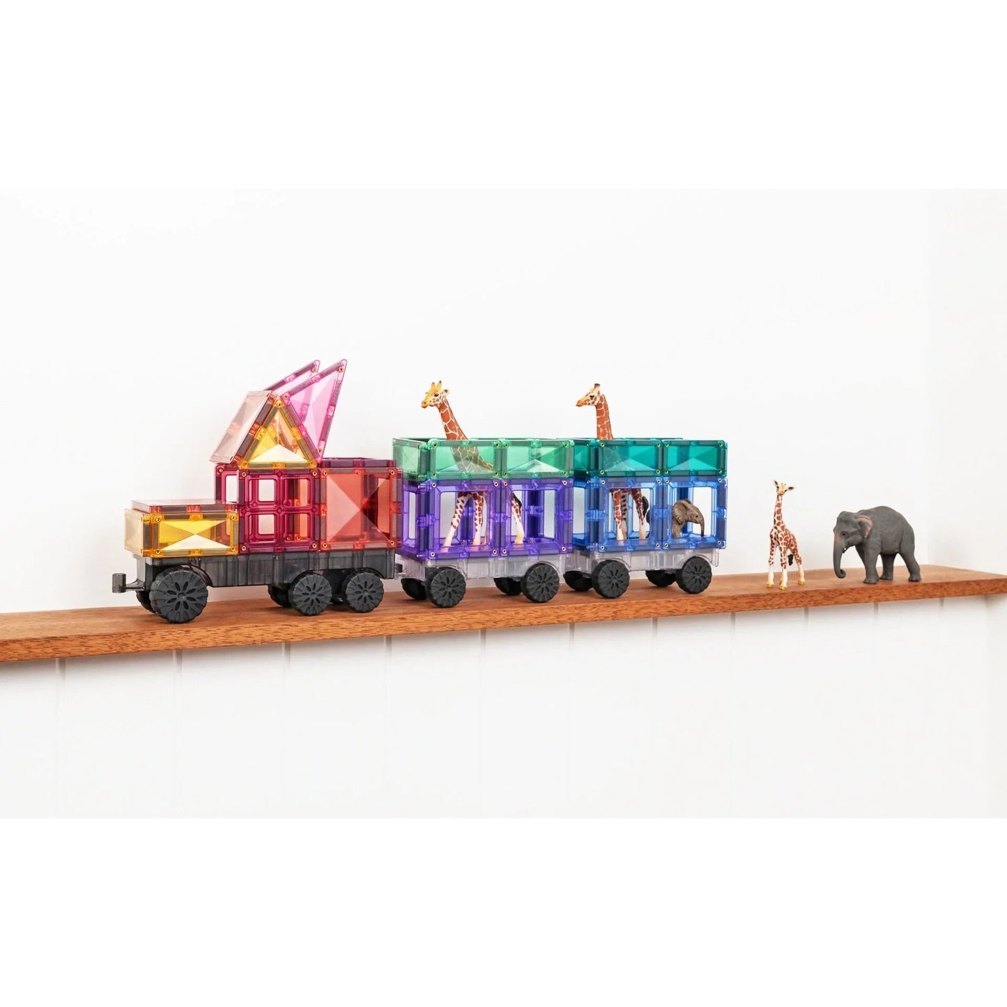 Bunte Spielzeuglok mit Tierfiguren auf Holz, Magnetbausteine Pastel Transport Pack