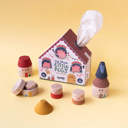 Holz-Haus-Stapelspiel My Three Little Pigs mit bunten Schweinen und Taschentuchspender
