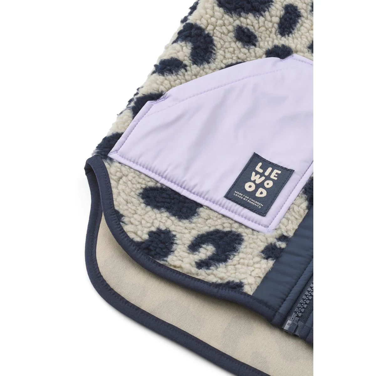 Noam pile vest mega leo mist mix eine gemütliche creme und marine fleecweste mit lavendelfarbenem innenfach und lie wood label