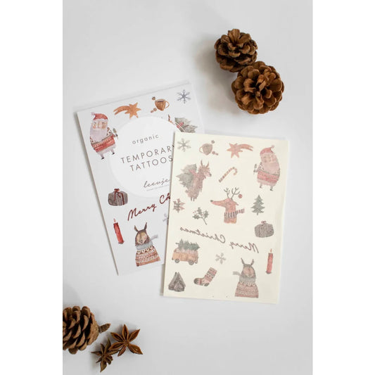 Weihnachtliche temporäre Tattoos mit Santa, Rentier und festlichen Designs von Organic Tattoos Christmas