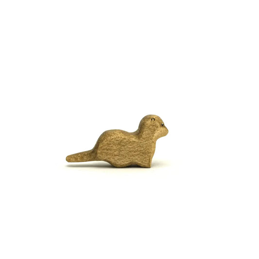 Carved wooden otter figurine displayed in Otter Klein product collection