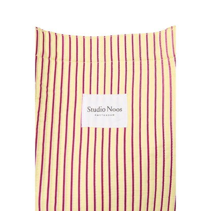 Gelb und kastanienbraun gestreiftes poplinn baumwoll-mom-bag mit studio noos amsterdam label ideal für ökologische baby- & kinderprodukte