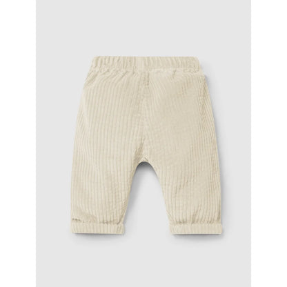 Helles cremefarbenes Corduroy-Babypantalon mit elastischem Bund und geknöpfte Bündchen