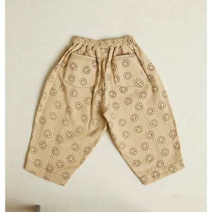 Beige rex joy butter trouser mit elastischem bund und verspieltem schwarzem smiley muster