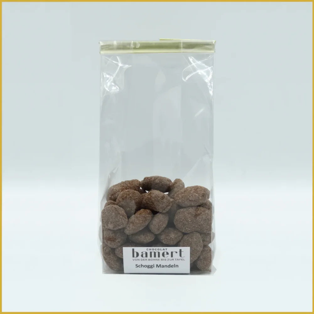 Schoggi Mandeln 100g mit klarer Plastiktüte voller schokolierten Mandeln