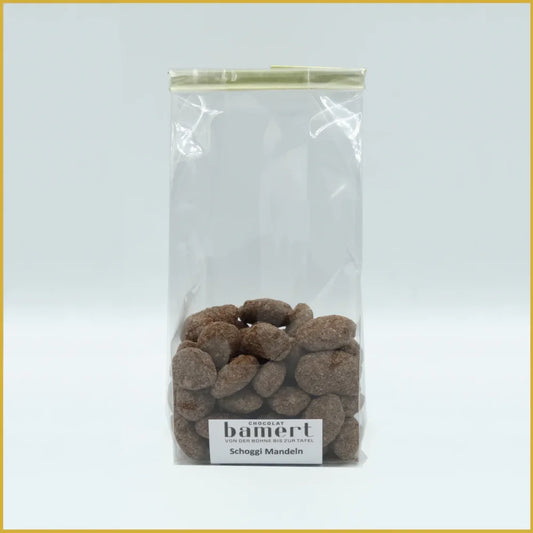 Schoggi Mandeln 100g mit klarer Plastiktüte voller schokolierten Mandeln