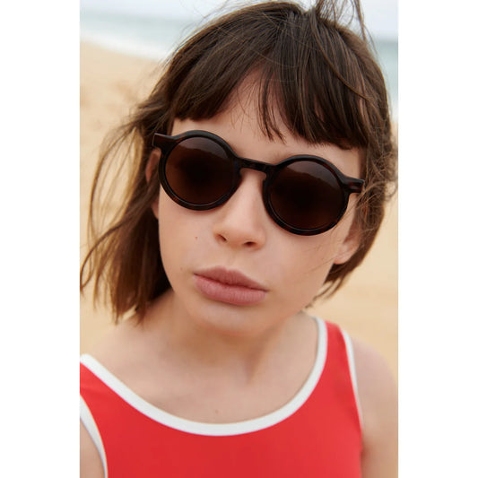 Schwarze runde Darla Sonnenbrille aus recyceltem Polycarbonat für Kinder
