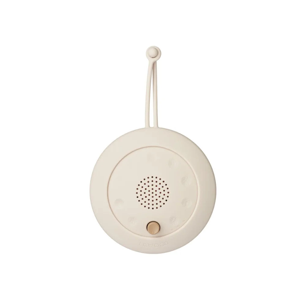 Creamfarbener runder tragbarer Weißrauschgenerator mit Hängeschlaufe und Steuerknopf