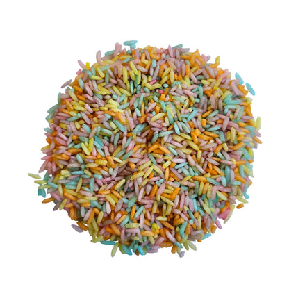 Bunte Reiskörner in einer kreisförmigen Anordnung für Spielreis-Mischung Pastel