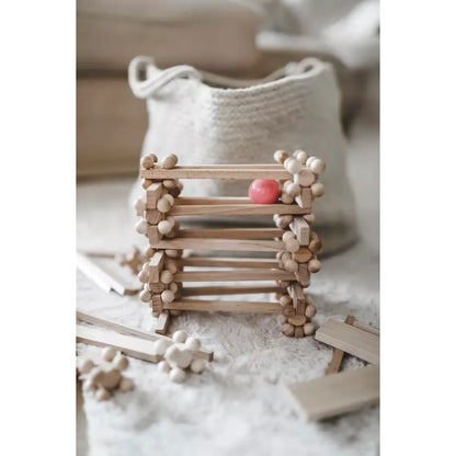 Zartes Holzbau-Spielzeug START 80 mit Brixis, Twister und Timber Bricks, rosa Ball oben