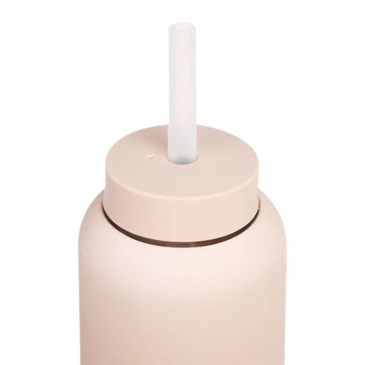 Pale pink cylindrical bottle Strohhalm Stone with white straw on top