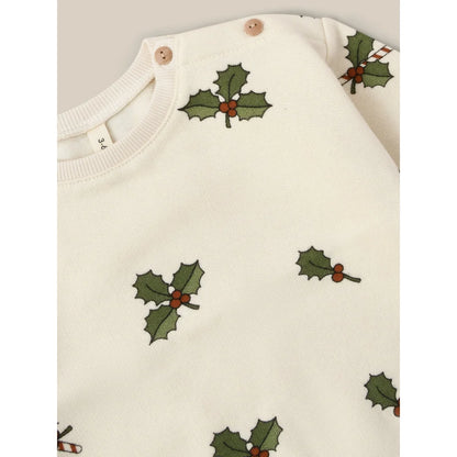 Weißer Baby-Overall mit Mistelblatt- und Beerenmuster aus der Kollektion Sweatshirt | Christmas Holly