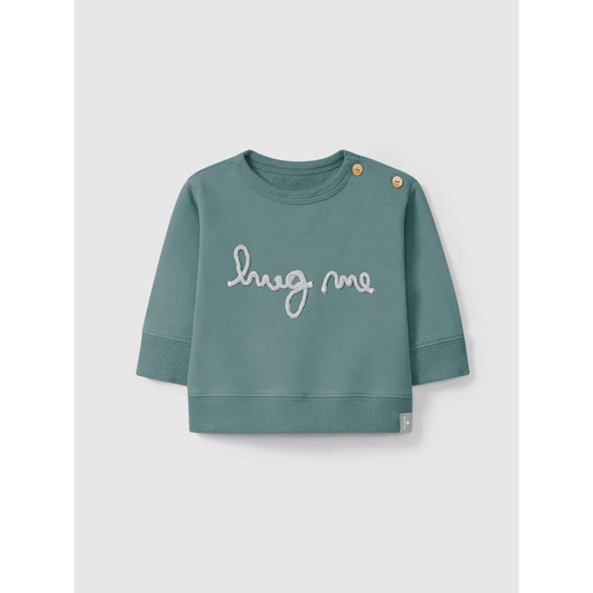 Teal Sweatshirt mit hug me in Schreibschrift auf der Vorderseite