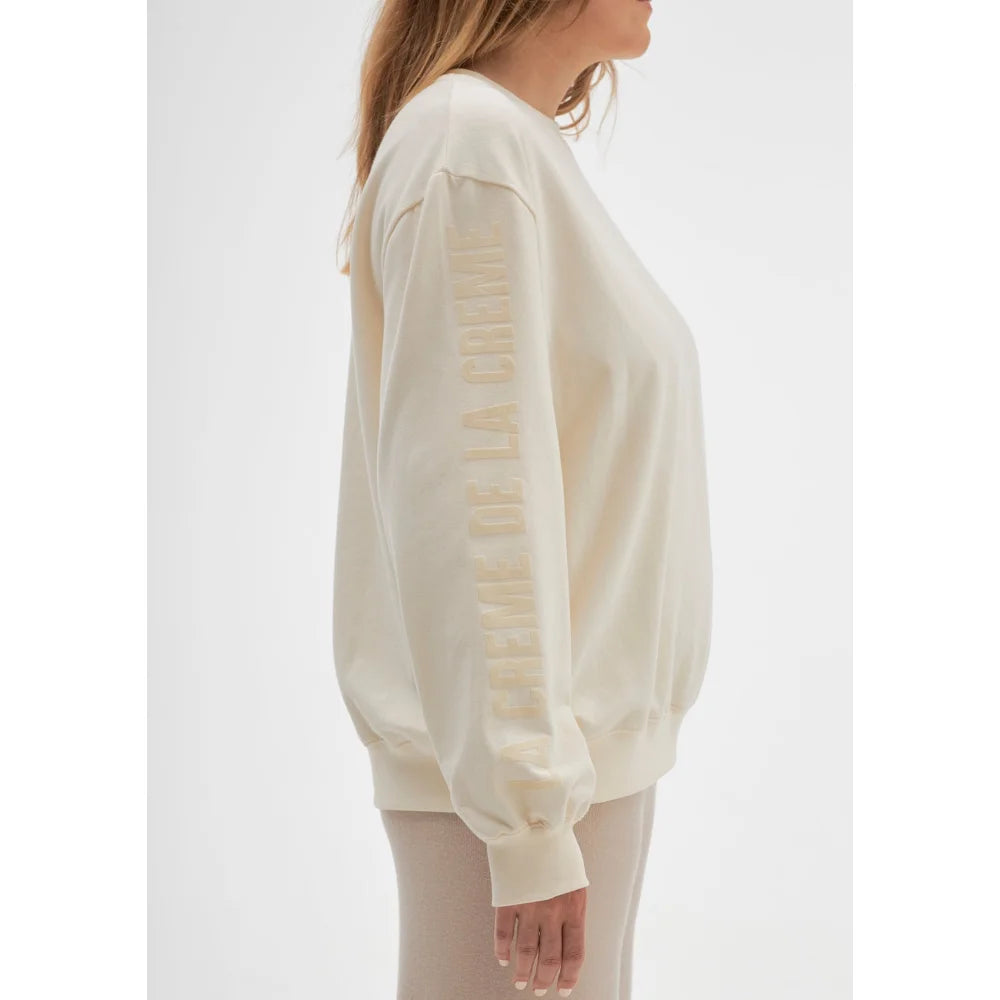 Cremefarbener Sweatshirt La crème de la crème auf weißem Hintergrund