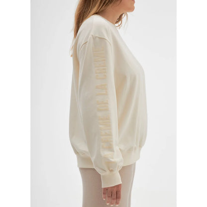 Cremefarbener Sweatshirt La crème de la crème auf weißem Hintergrund