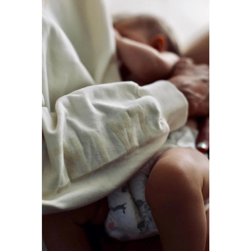 Baby in diaper being held modeled on Sweatshirt La crème de la crème