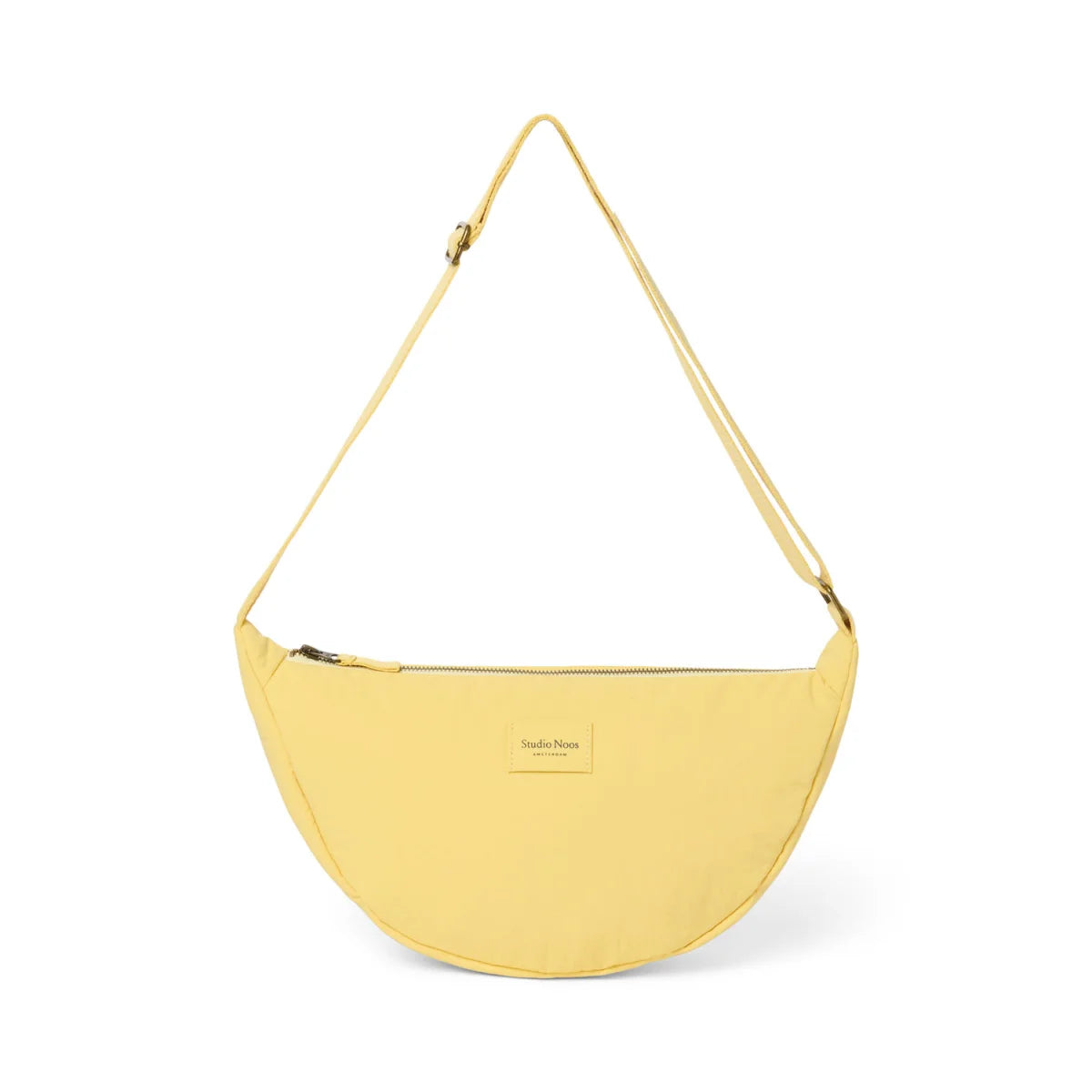 Texturierte puffy erwachsenen fanny pack buttergelb in blassem gelb mit minimalistischem crescent crossbody-design