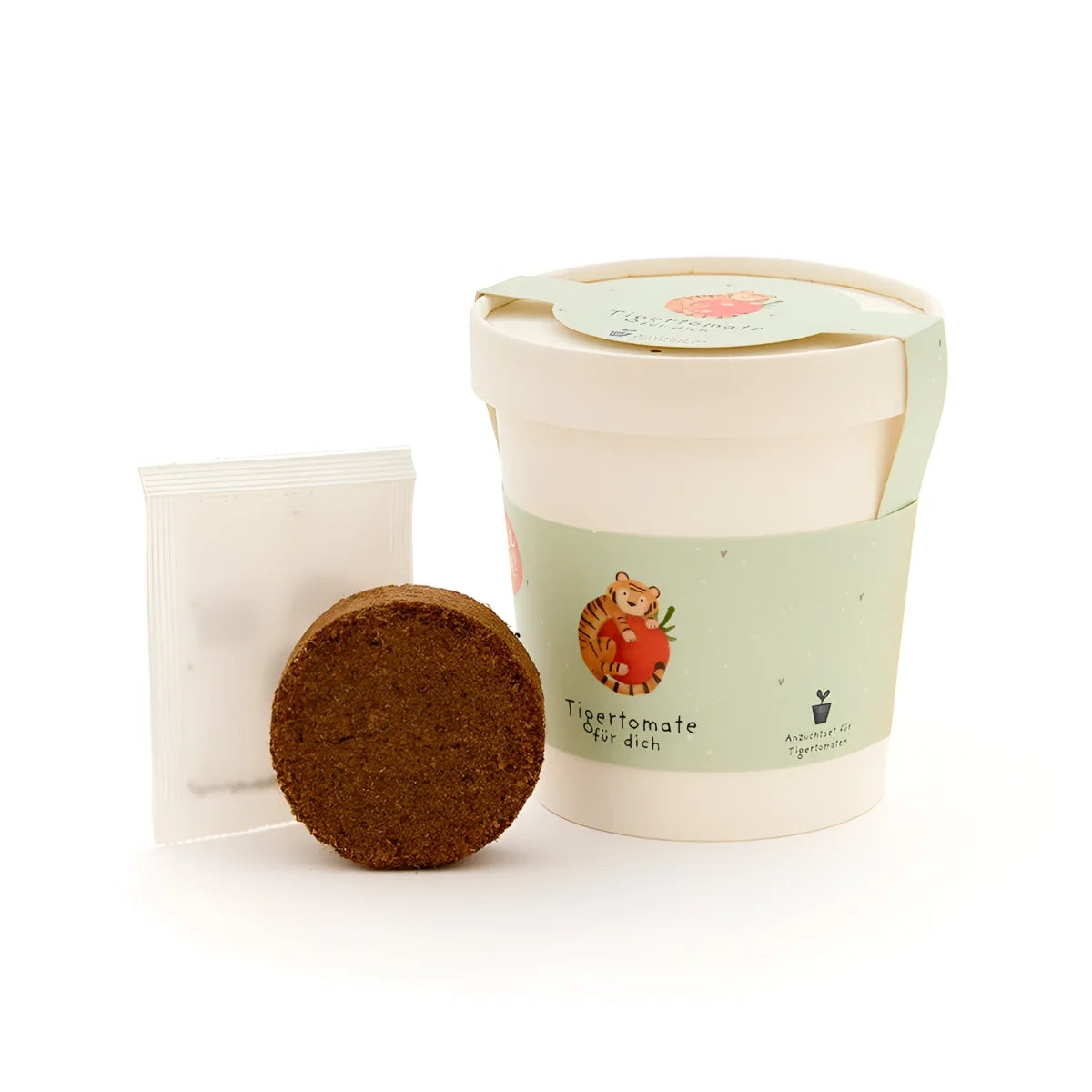 Ein nachhaltig gestalteter tigertomate becher in weiß und hellgrün mit tigermotiv und kokosfasersamenstarter als ökologische geschenke für neugeborene