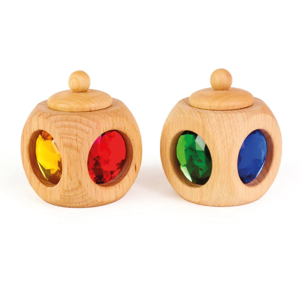 Holzball mit bunten Edelsteinen in der Tooth Box