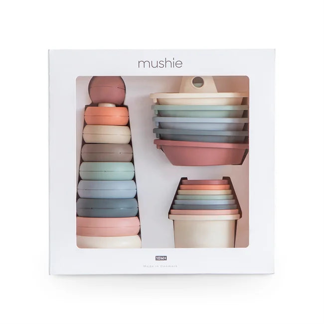 Mushie stapelringe set in sanften pastellfarben aus glattem silikon im toy gift box spielzeuggeschenk