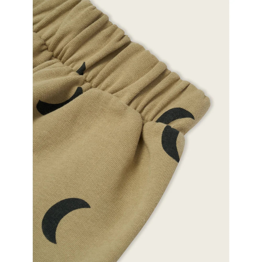 Elastischer Bund beige Shorts mit schwarzen Halbmondmustern für Traveller Pants Dusky Midnight