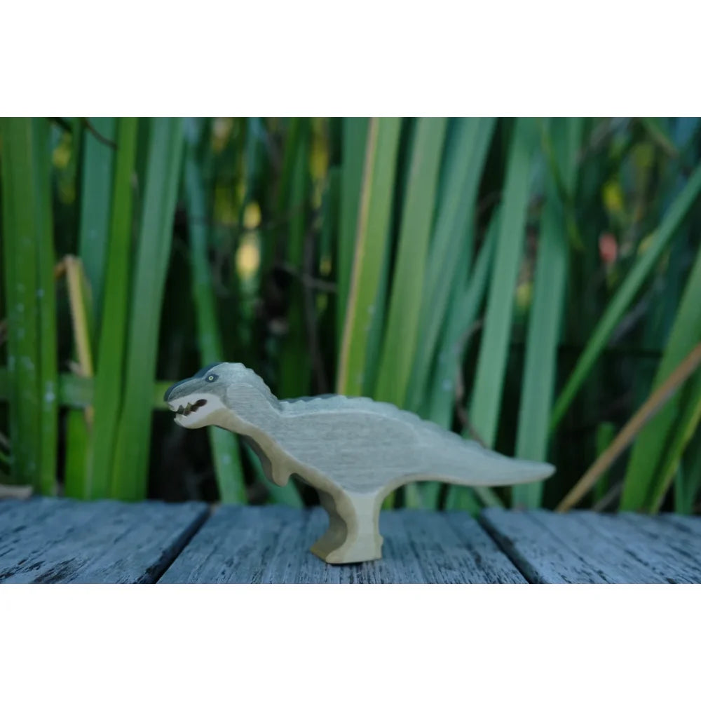 Hellgraues Tyrannosaurus Rex Spielzeug mit texturiertem Rücken und dunklen Augen