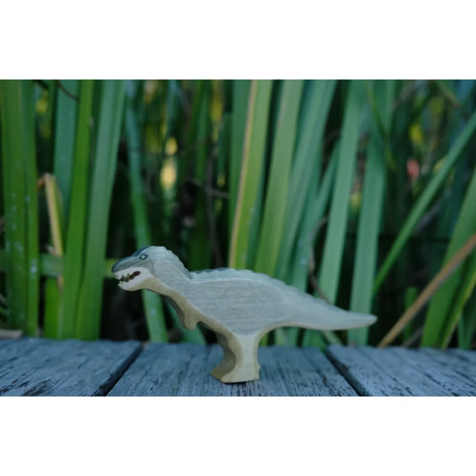 Hellgraues Tyrannosaurus Rex Spielzeug mit texturiertem Rücken und dunklen Augen