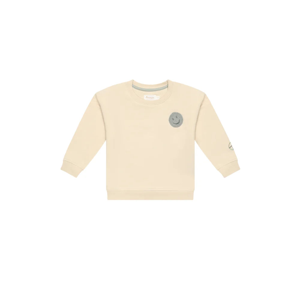 Creamfarbener unisex oversized Sweatshirt mit Smiley, Tasche und Rippbündchen