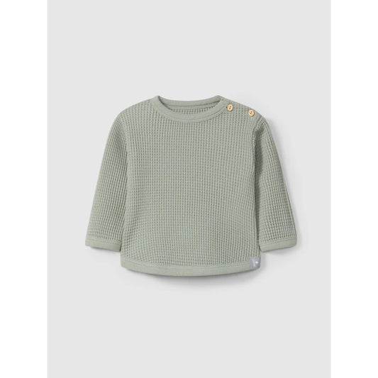 Pale green knitted Waffelsweater with shoulder buttons for infants or toddlers