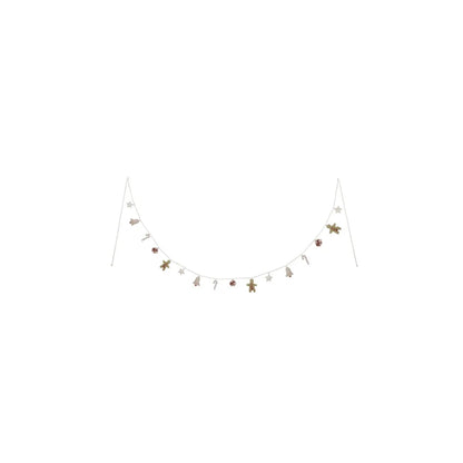 Weihnachtsgirlande mit Zuckerstangen, Sternen, Glocken und Lebkuchen in Burgund